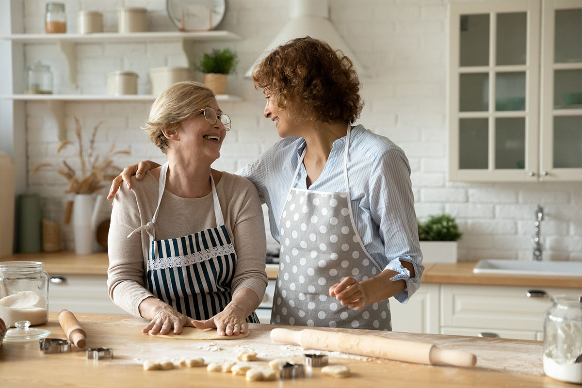 two women baking in kitchen