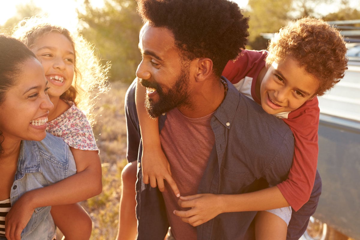 man and woman with two children