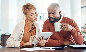 couple looking at ipad image
